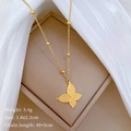 Macro shot of gold butterfly necklace pendant with specs 1.8x2.2cm and 3.4g weight - Gold