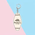 Acrylic mountain keychain with The Mountains Are Calling slogan and vintage oval shape - The Mountains Are Calling (Beige)