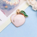 Pink peach fruit charm pendant in golden alloy with green leaf detail and drip oil finish - 1 Piece (16x17mm)