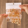 Golden earrings set featuring geometric hoops and pearl drops on display card - 03 KC Gold