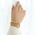 Gold titanium bracelet with cubic zirconia baguette stones and magnetic horseshoe buckle - Gold Champagne Zircon