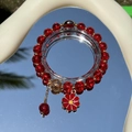 Exquisite red bead bracelet with golden accents and flower charm on mirror surface - S060 - Bright Red Daisy Bracelet #sz533