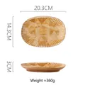 Japanese style coarse ceramic oval pasta plate in earthy yellow with ribbed texture - Dark Brush Stroke Chrysanthemum Plate