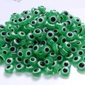 Flat round resin devil eye spacer beads in green for DIY jewelry making and crafts - Green