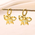 Detailed close-up of golden bow-shaped drop earrings hanging on a natural wooden branch - Polished Metal Bowknot Drop Earrings-E4823G