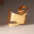 Detailed view of polished gold layered wrap cuff bracelet with irregular geometric design - Arm Cuff / Gold