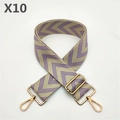 Close-up of beige fabric bag strap with purple herringbone pattern and gold metal hardware - Purple