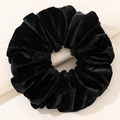 Detailed close-up of premium black velvet scrunchie showing rich texture and soft pleats - Black