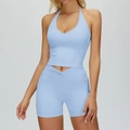 Light blue yoga set with halter neck sports bra and crisscross high-waist shorts - S / Top And Bottom / Blue