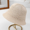 Detail of beige crochet bucket hat with hollow pattern on a golden stand - M(56-58cm) / Beige