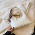 White crescent underarm bag with a decorative printed silk scarf on the handle - White