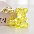 Detailed macro view of a yellow faceted crystal bear keychain with elegant gold hardware - Lemon Yellow