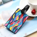 Colorful geometric PVC luggage tag with adjustable strap and vibrant multicolor pattern - Feather