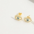 Minimalist evil eye stud earrings in golden finish with white and blue crystals - Blue Eyelashes