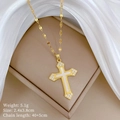 Detailed view of a gold cross necklace with white inlay and sparkling small diamonds - Gold Cross Style (A306)