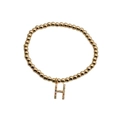 Minimalist gold bead bracelet featuring a colorful zircon micro-pave H letter charm - Letter H