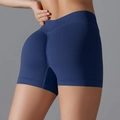 Dettaglio dei pantaloncini da yoga blu scuro senza cuciture con vita alta ed effetto push-up - S / Blu scuro