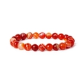 Macro detail of natural red agate beads showing unique banded textures and polished finish - Orange Line Agate