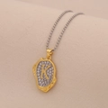 Macro detail of a gold letter K pendant with sparkling crystals on a bead chain necklace - Letter K