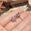 Macro detail of pink square-cut gemstone earrings with white zircon halo on palm - 0255 Pink Square Gem Pave Studs
