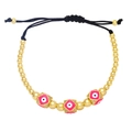 Bohemian adjustable evil eye beaded bracelet with pink enamel and gold-plated metal accents - Rose Red