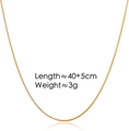 Close-up of 40+5cm golden stainless steel snake chain necklace with sleek metal finish - Thin Adjustable / Gold