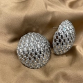 Close-up of silver-tone chain earrings with sparkling cubic zirconia on bronze silk cloth - Silver Round