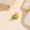 Detailed view of a gold spider pendant featuring an oval blue gemstone inlay for DIY jewelry - Light Blue
