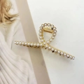 Elegant gold metal hair claw clip with white pearls in a twisted luxury design - Twisted Pearl Style (F-015)