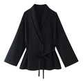 Detail of black woven wrap top featuring a tie-waist closure and long sleeves - Black Top