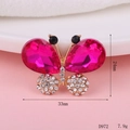 Macro view of pink crystal butterfly charm with rhinestones measuring 24mm by 33mm - D972 Crystal Butterfly (Rose Red)