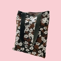 Knitted floral tote bag with brown and white patterns and wide black shoulder straps - Dark Green Floral White