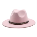 Detailed close-up of pink wool fedora with ethnic woven band and leather strap - Pink