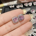 Macro shot of 18K gold pink heart earrings featuring cubic zirconia and bow detail - 0261 Pink Purple Round Halo Studs
