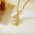Close-up of heart-shaped gold necklace with zircon stone on elegant white stone background - Gold White Zircon Lock Heart Necklace (T021)