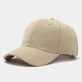 Detail view of beige baseball cap featuring textured linen fabric and curved brim design - Beige