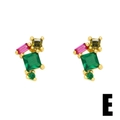 Detail of gold stud earrings featuring emerald and pink zircon geometric crystals - Style E-Geometric Color Zircon