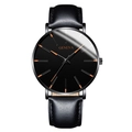Reloj de cuarzo negro con índices naranjas y correa de cuero negro en fondo blanco puro - Caja Negra Esfera Negra Aguja Oro Rosa Correa Cuero Negra
