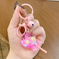 Pink lollipop keychain with floating resin balls and a heart bell for bag charm - Pink Lollipop Milk Bean