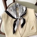 Elegant black and white geometric pattern silk scarf styled with a beige blazer coat - Diamond-shaped White Square Scarf / 65