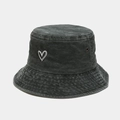 Close-up of heart embroidery and copper eyelets on washed grey denim bucket hat - Army Green
