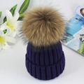 Thick navy blue ribbed knit beanie featuring a large fluffy brown fur pompom detail - Royal Blue