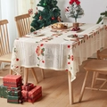 Detail view of festive Christmas embroidery with red bells and holly on cream lace tablecloth - 140*100cm / Christmas Bell