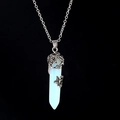 Silver dragonfly necklace with a white opal hexagonal crystal pendant on black background - Opalite