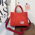 Red corduroy crossbody tote bag with adjustable shoulder strap and external pocket - Red