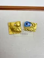 Detailed view of vintage evil eye ring with hammered gold texture and artistic contour - 26 Blue Demon Eye Earrings Eh1360