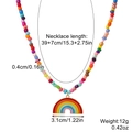 Handmade rainbow beaded necklace featuring a colorful heart pendant with dimension labels - Seed Bead Rainbow Necklace