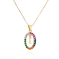 Macro shot of 18K gold plated oval pendant with rainbow zircon stones and letter I - Letter I