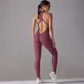 Detail view of the deep purple yoga jumpsuit featuring a scrunch butt and open back design - S / Burgundy
