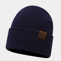 Detail of navy knit beanie showing thick ribbed texture and leather compass logo patch - One Size / Navy Blue